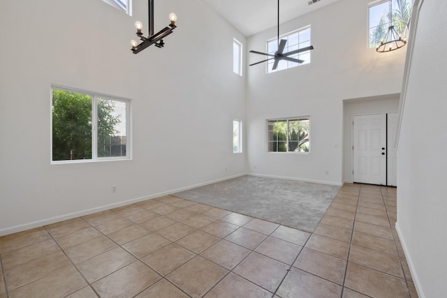 3225 N Mendonca St, Visalia, CA 93291 - foyer with a chandelier, plenty of natural light, light tile patterned flooring, and a towering ceiling