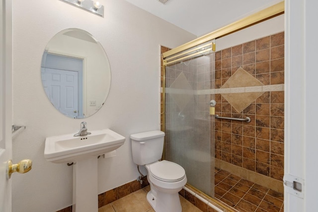 3225 N Mendonca St, Visalia, CA 93291 - full bath featuring toilet, a stall shower, baseboards, and tile patterned floors