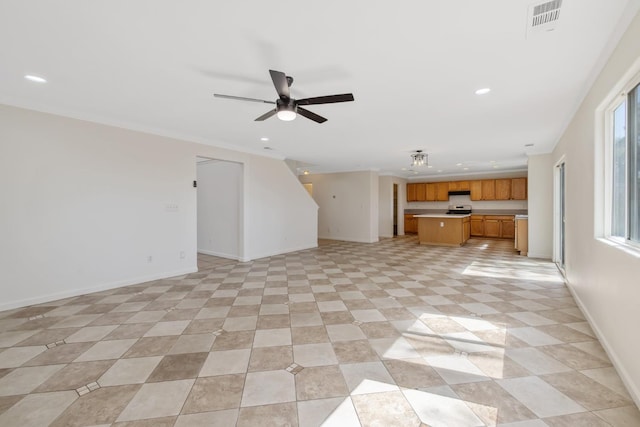 3225 N Mendonca St, Visalia, CA 93291 - unfurnished living room featuring recessed lighting, baseboards, ceiling fan, and crown molding