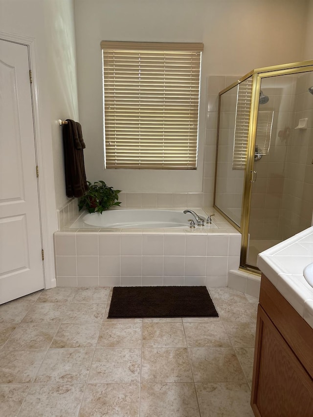 2644 Gibson Ave, Clovis, CA 93611 - bathroom featuring a stall shower, a bath, and vanity