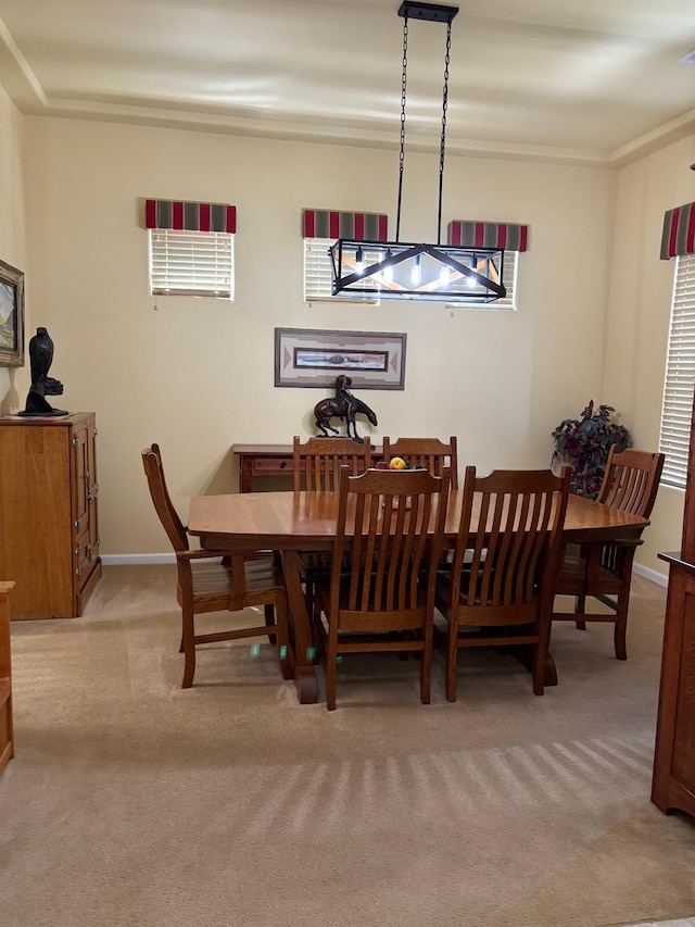 2644 Gibson Ave, Clovis, CA 93611 - dining area featuring light carpet and ornamental molding