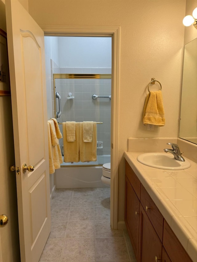 2644 Gibson Ave, Clovis, CA 93611 - bathroom featuring toilet, vanity, and enclosed tub / shower combo