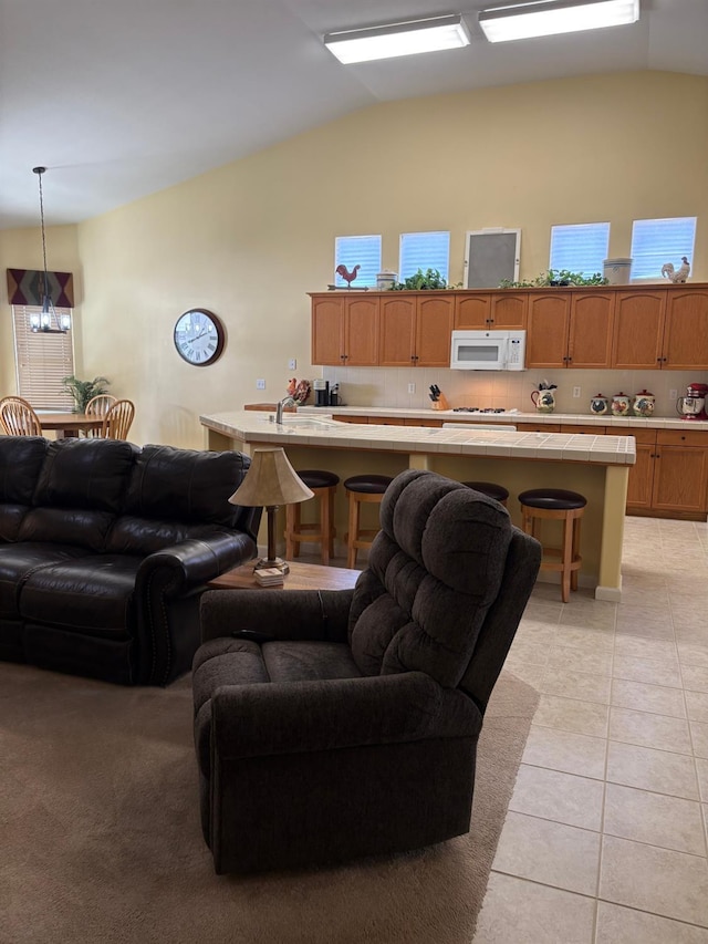 2644 Gibson Ave, Clovis, CA 93611 - living area with lofted ceiling and light tile patterned floors