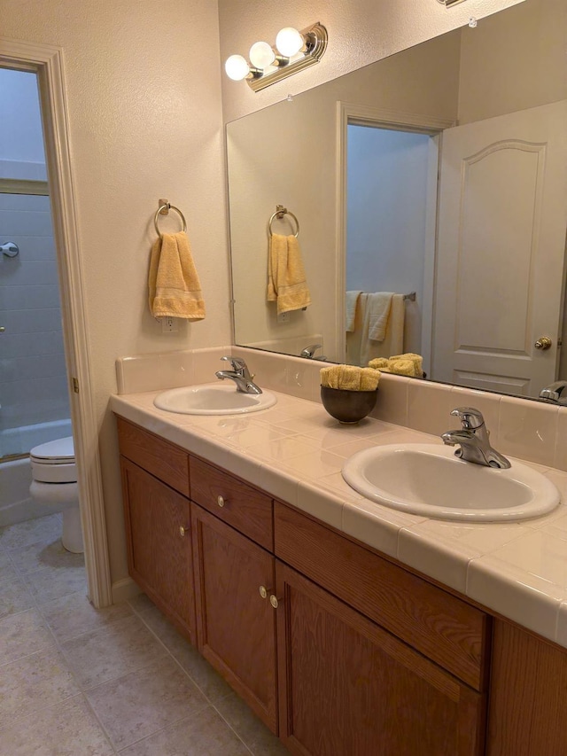 2644 Gibson Ave, Clovis, CA 93611 - full bath featuring toilet, tile patterned floors, and double vanity
