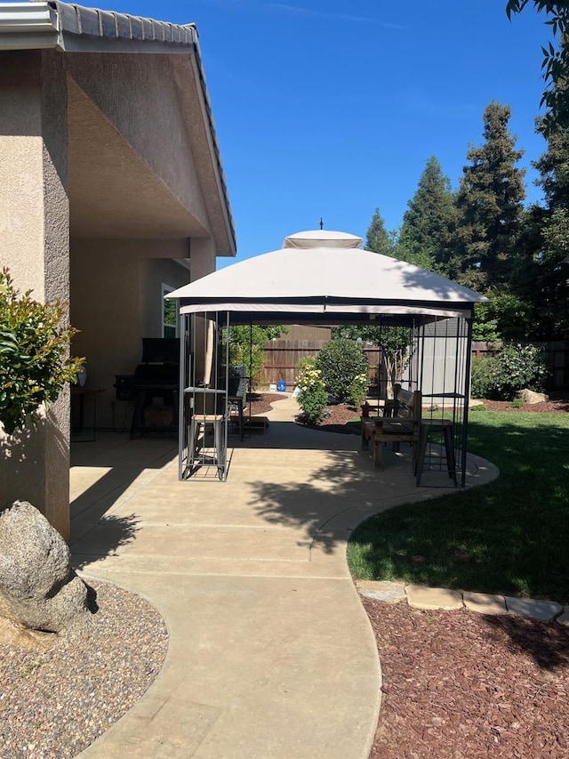 2644 Gibson Ave, Clovis, CA 93611 - view of patio / terrace featuring a gazebo and fence