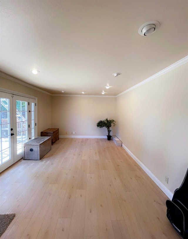 752 E Stuart Ave, Fresno, CA 93710 - unfurnished living room with crown molding, baseboards, french doors, light wood-style floors, and recessed lighting