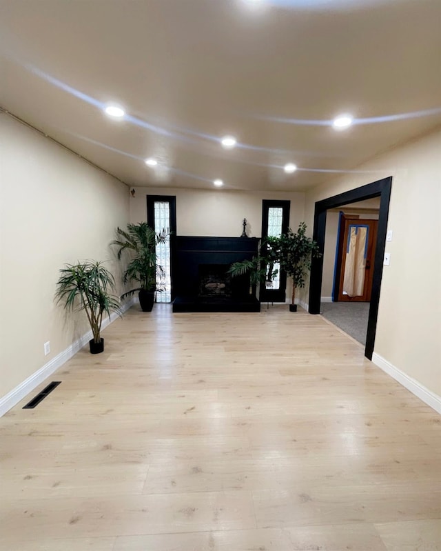 752 E Stuart Ave, Fresno, CA 93710 - living room with wood finished floors, a fireplace, recessed lighting, and baseboards