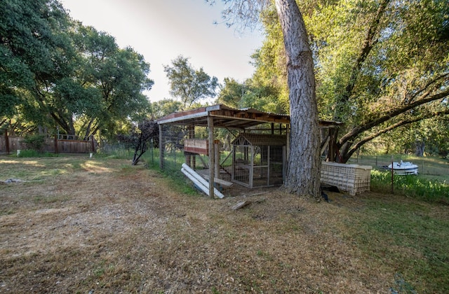 47438 Cheyenne Rd, Coarsegold, CA 93614 - view of yard with exterior structure, an outdoor structure, and fence