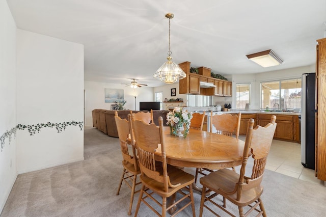 5532 N Cleo Ave, Fresno, CA 93722 - dining room with light colored carpet and a ceiling fan