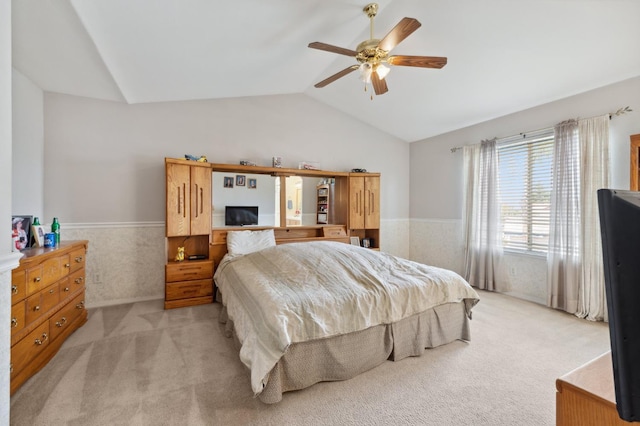5532 N Cleo Ave, Fresno, CA 93722 - bedroom featuring a wainscoted wall, vaulted ceiling, light colored carpet, and a ceiling fan