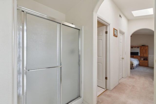 5532 N Cleo Ave, Fresno, CA 93722 - ensuite bathroom featuring a shower stall and a skylight