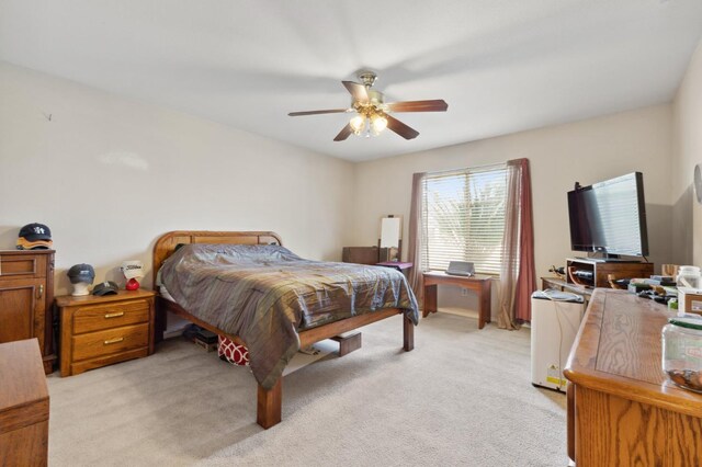 5532 N Cleo Ave, Fresno, CA 93722 - bedroom with light colored carpet and ceiling fan