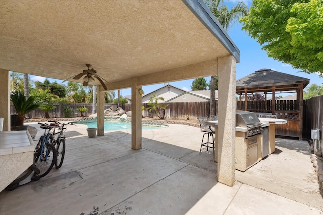 5532 N Cleo Ave, Fresno, CA 93722 - view of patio with exterior kitchen, a fenced backyard, and a ceiling fan