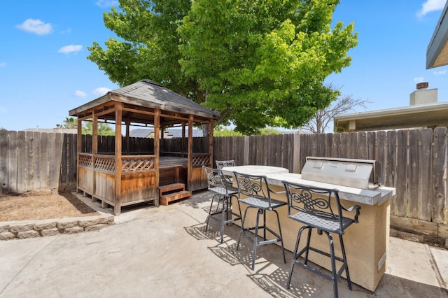 5532 N Cleo Ave, Fresno, CA 93722 - view of patio / terrace featuring a gazebo, a fenced backyard, and a hot tub