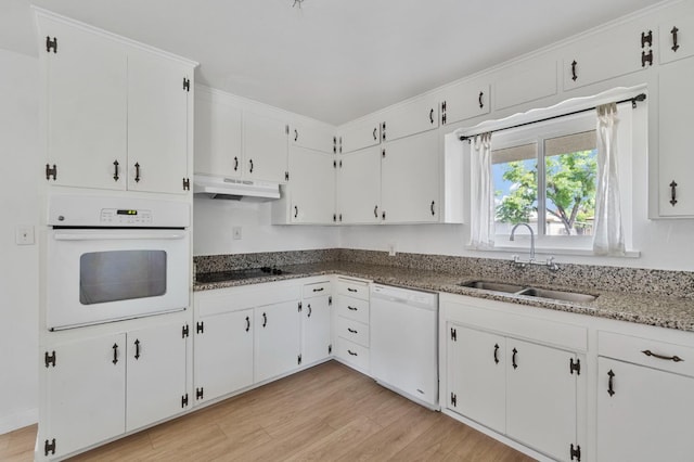 638 W Dennis Dr, Clovis, CA 93612 - kitchen with white appliances, a sink, under cabinet range hood, light wood-type flooring, and white cabinets