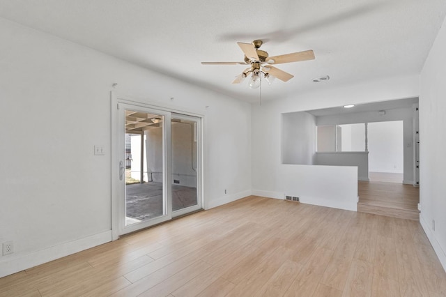 638 W Dennis Dr, Clovis, CA 93612 - unfurnished room featuring a ceiling fan, baseboards, and light wood-style floors