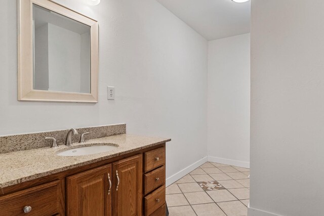 638 W Dennis Dr, Clovis, CA 93612 - bathroom featuring vanity, tile patterned flooring, and baseboards
