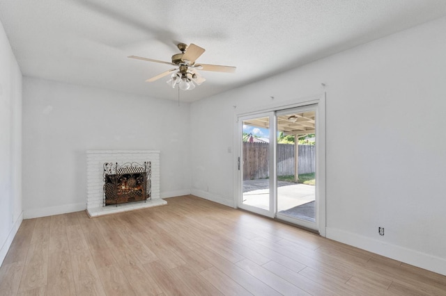 638 W Dennis Dr, Clovis, CA 93612 - unfurnished living room featuring a ceiling fan, light wood finished floors, baseboards, and a fireplace