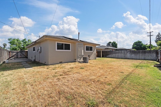 638 W Dennis Dr, Clovis, CA 93612 - rear view of house with solar panels, crawl space, and stucco siding