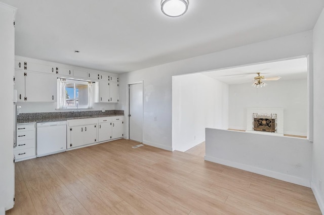 638 W Dennis Dr, Clovis, CA 93612 - kitchen with dishwasher, dark countertops, light wood-style flooring, and white cabinets