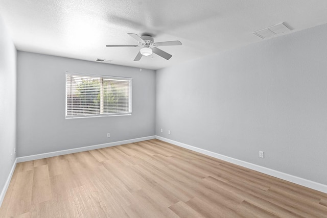 3656 N Laverne Ave, Fresno, CA 93727 - spare room with light wood-type flooring, a ceiling fan, and baseboards