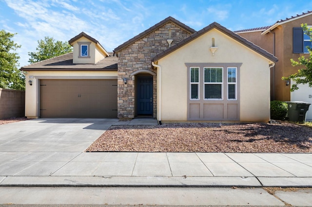 3874 Hampton Way, Clovis, CA 93619 - view of front of home with stucco siding, a garage, stone siding, and concrete driveway