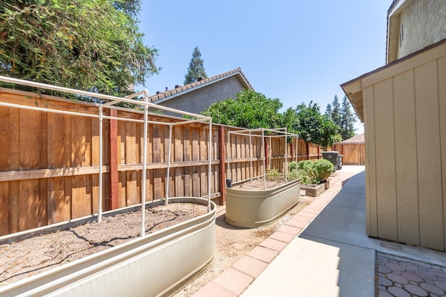 373 W Houston Ave, Clovis, CA 93611 - view of patio with a vegetable garden
