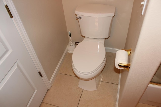 373 W Houston Ave, Clovis, CA 93611 - bathroom featuring toilet, tile patterned flooring, and baseboards