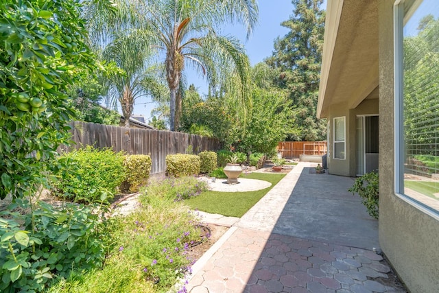 373 W Houston Ave, Clovis, CA 93611 - fenced backyard featuring a patio