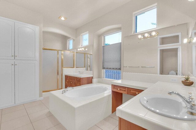 373 W Houston Ave, Clovis, CA 93611 - full bathroom with a garden tub, two vanities, tile patterned floors, and a shower