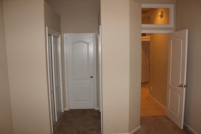 373 W Houston Ave, Clovis, CA 93611 - corridor featuring carpet floors, baseboards, and tile patterned flooring
