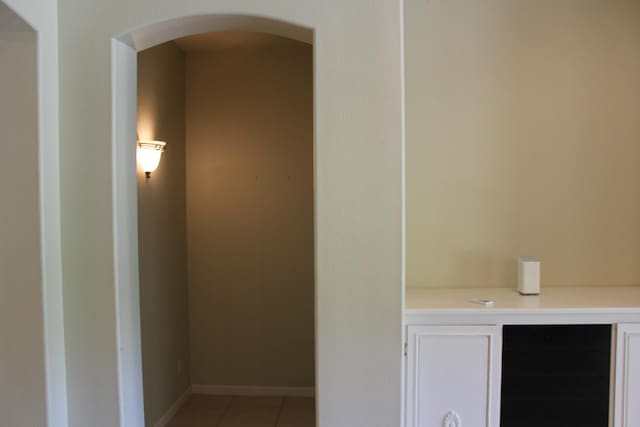 373 W Houston Ave, Clovis, CA 93611 - bathroom featuring beverage cooler, tile patterned flooring, and baseboards