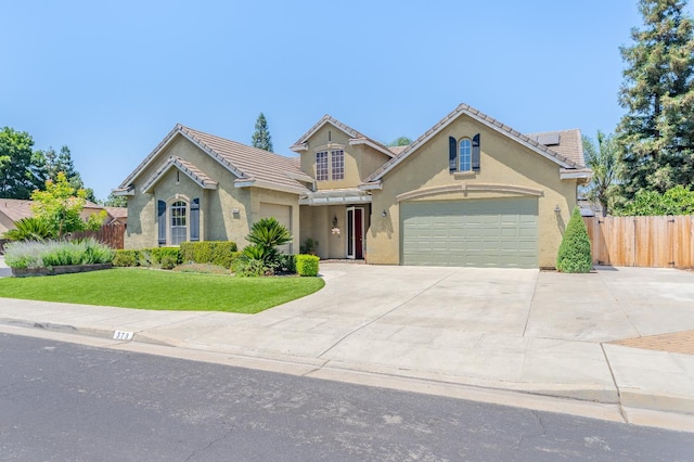 373 W Houston Ave, Clovis, CA 93611 - view of front of home featuring roof mounted solar panels, concrete driveway, stucco siding, and a tiled roof