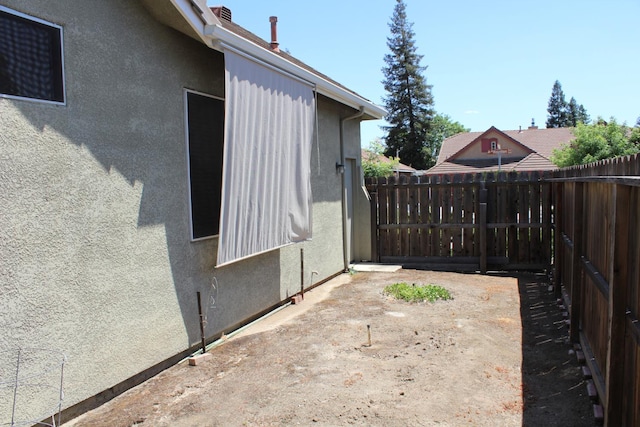 373 W Houston Ave, Clovis, CA 93611 - view of home's exterior with fence and stucco siding