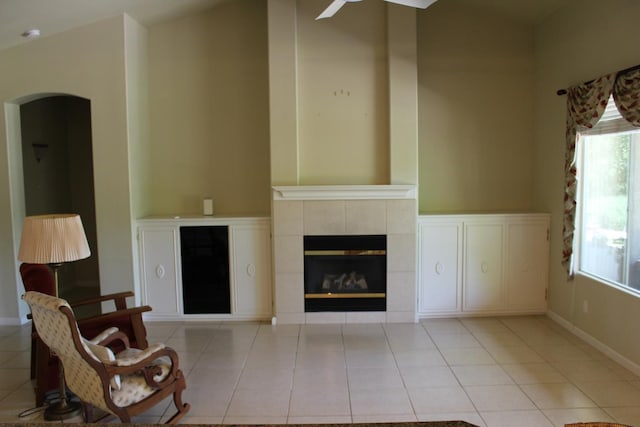 373 W Houston Ave, Clovis, CA 93611 - living room with light tile patterned flooring, plenty of natural light, a fireplace, and arched walkways