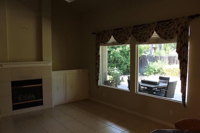 373 W Houston Ave, Clovis, CA 93611 - unfurnished living room featuring tile patterned flooring, baseboards, and a tiled fireplace