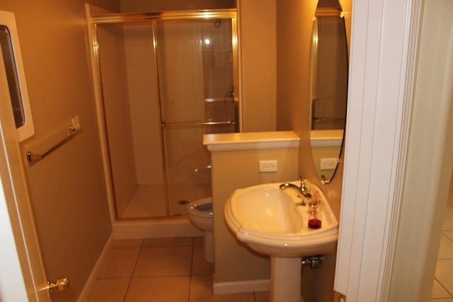 373 W Houston Ave, Clovis, CA 93611 - bathroom with tile patterned flooring, baseboards, and a shower stall