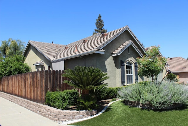 373 W Houston Ave, Clovis, CA 93611 - view of property exterior with stucco siding and a tiled roof