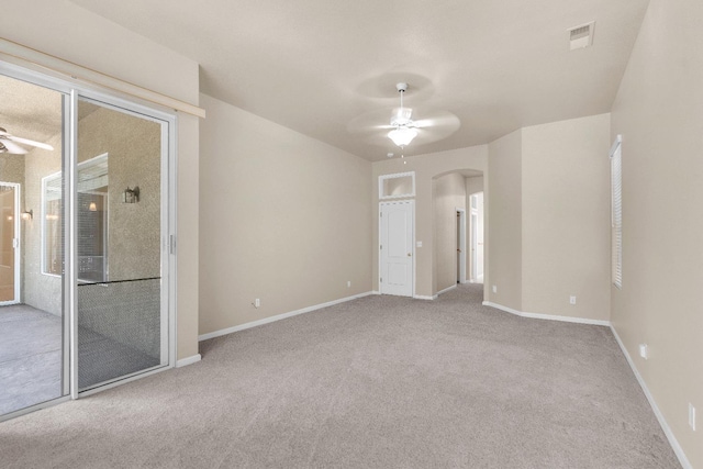 373 W Houston Ave, Clovis, CA 93611 - carpeted empty room with a ceiling fan and arched walkways