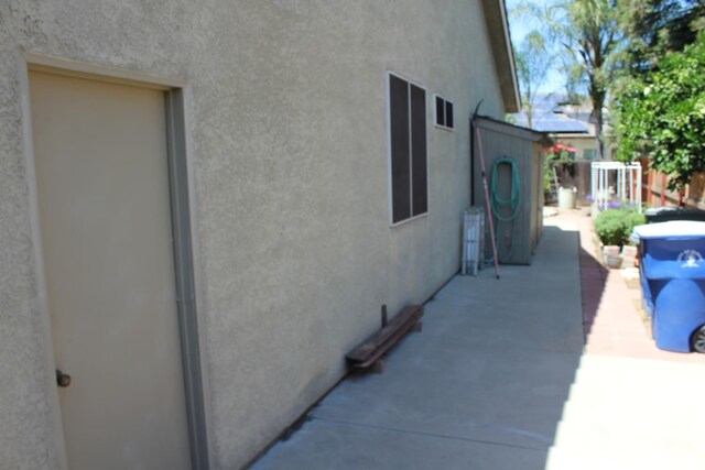 373 W Houston Ave, Clovis, CA 93611 - view of home's exterior with stucco siding and fence