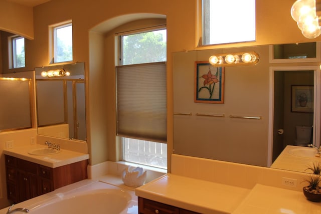 373 W Houston Ave, Clovis, CA 93611 - bathroom featuring a garden tub and vanity