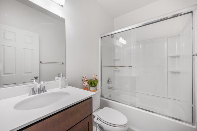 746 E Curtis Ave, Fowler, CA 93625 - bathroom with toilet, vanity, and shower / bath combination with glass door