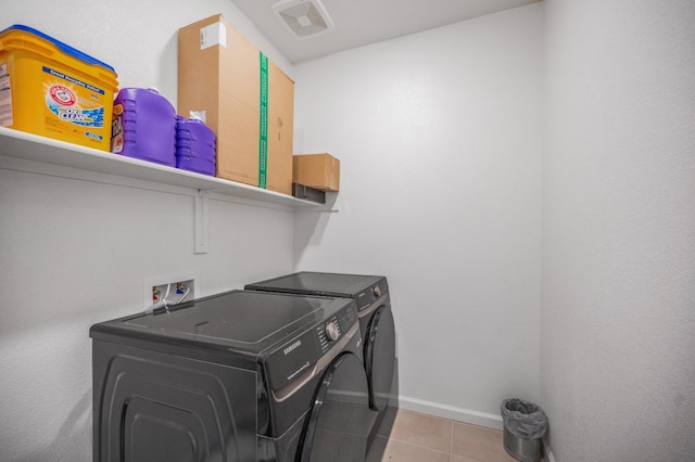 746 E Curtis Ave, Fowler, CA 93625 - laundry room featuring separate washer and dryer, tile patterned floors, and baseboards