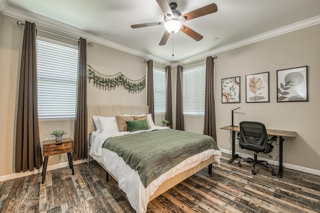 bedroom featuring dark wood finished floors, ornamental molding, baseboards, a ceiling fan, and an office area