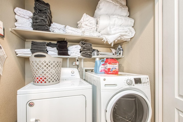 washroom featuring washer and clothes dryer