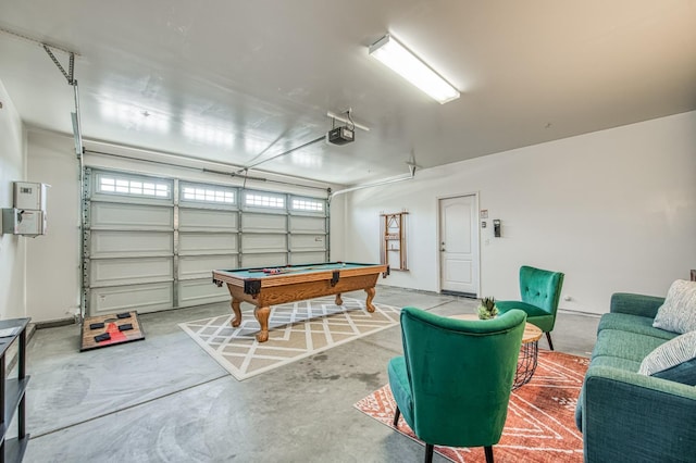 playroom featuring billiards, a garage, concrete flooring, and healthy amount of natural light