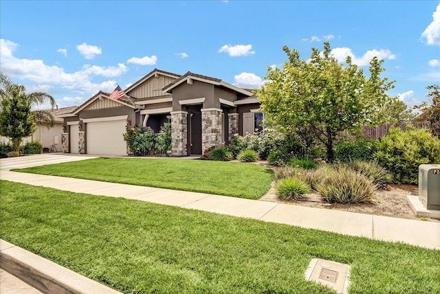 2315 W Malone St, Hanford, CA 93230 - view of front facade featuring an attached garage, a front yard, concrete driveway, stucco siding, and stone siding