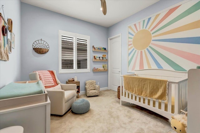 2315 W Malone St, Hanford, CA 93230 - bedroom featuring a crib, carpet floors, and baseboards