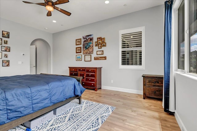2315 W Malone St, Hanford, CA 93230 - bedroom featuring arched walkways, light wood finished floors, baseboards, recessed lighting, and ceiling fan