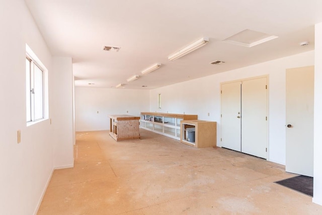 16895 Rd 30 1/2, Madera, CA 93636 - unfurnished room featuring baseboards and bar area